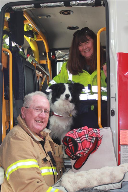 Karen Meredith-Thomas, her dog Jessica, Newham Captain Bryan Hornbuckle and just a handful of the winter warming supplies collected by the brigade.