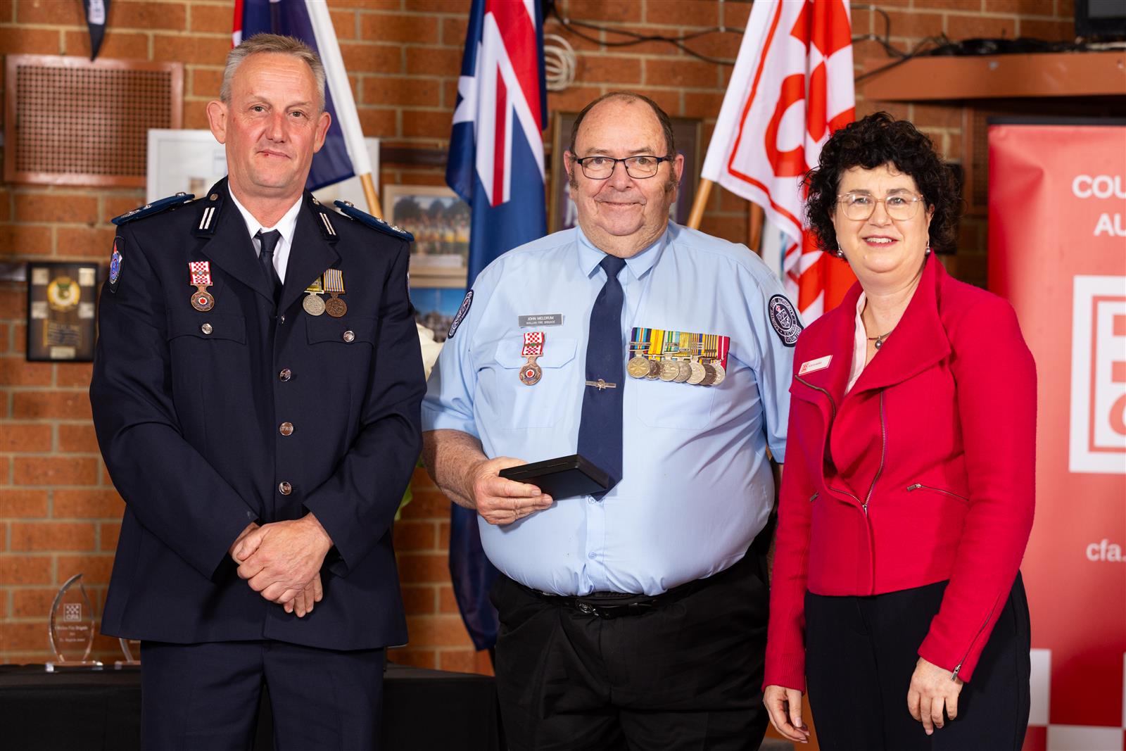 Brigade Member John Meldrum (centre) received his 35 year CFA Service Medal, pictured with A/Commander Paul Brislin & Interim CEO Robyn Harris