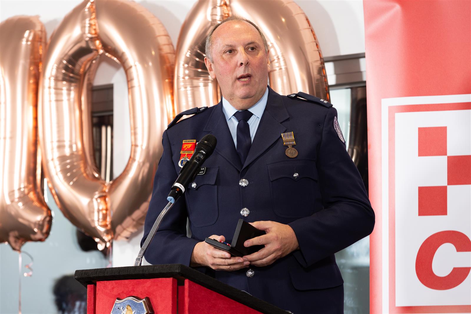 Graham Fountain accepting his Outstanding Service Medal