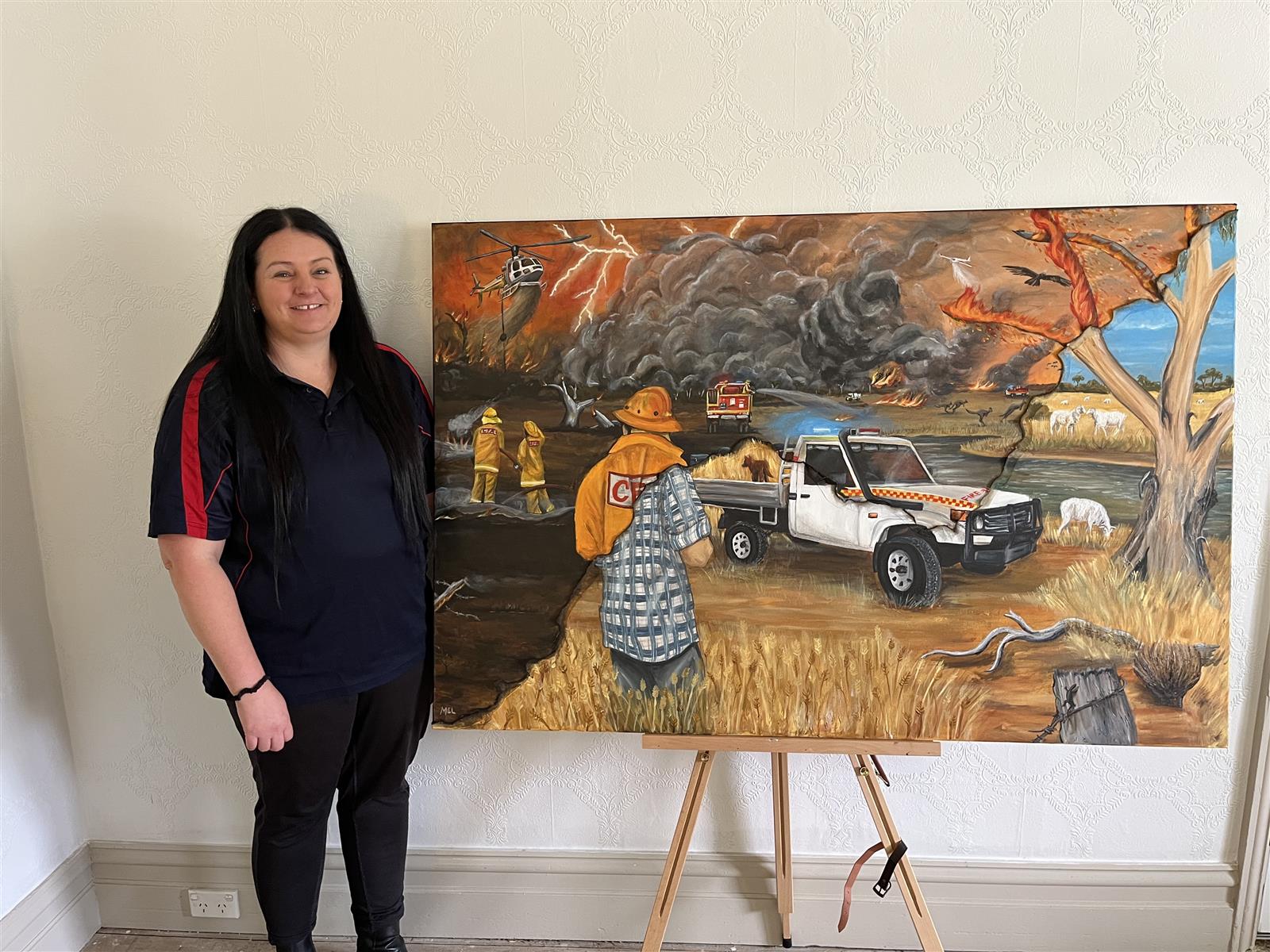 Dimboola Fire Brigade member Melinda Heatley and her painting.