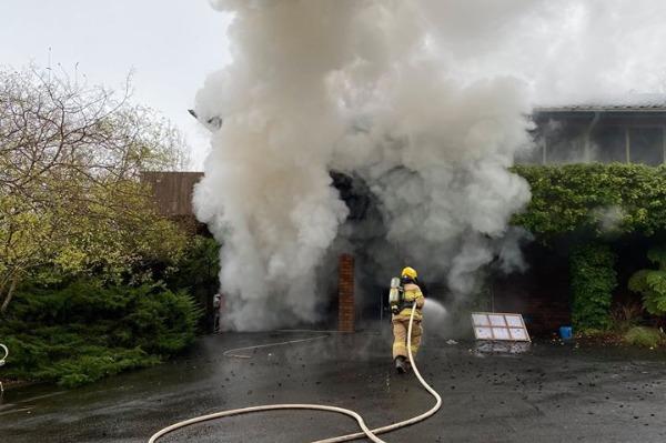 Crews extinguish fierce garage fire