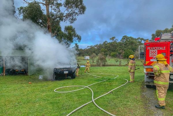 Crews work together to contain car fire